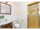 Bathroom features white wainscotting and a retro, bright yellow shower at 4832 Brookhaven Dr, Raleigh, NC 27612