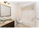 Bathroom featuring granite vanity top, neutral color scheme, and shower-tub combination at 4832 Brookhaven Dr, Raleigh, NC 27612