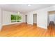 Primary bedroom with hardwood floors and views at 4832 Brookhaven Dr, Raleigh, NC 27612