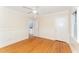 Bedroom showcasing wood floors, wainscotting, and a bright atmosphere with natural light at 4832 Brookhaven Dr, Raleigh, NC 27612