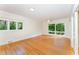 Light filled bedroom with dual windows and hardwood floors at 4832 Brookhaven Dr, Raleigh, NC 27612