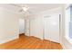 Bedroom with hardwood floors, a ceiling fan, and double closets at 4832 Brookhaven Dr, Raleigh, NC 27612