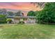 Charming single-story home with a spacious backyard, brick accents, and well-manicured landscaping at 4832 Brookhaven Dr, Raleigh, NC 27612