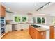 Bright kitchen with a center island, granite countertops, and stainless steel appliances at 4832 Brookhaven Dr, Raleigh, NC 27612