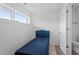 A modern bedroom featuring a twin bed and ensuite bathroom at 512 Gordon St # 1006, Durham, NC 27701