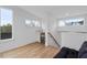 Bright living room features hardwood floors, a wet bar and three large windows offering ample natural light at 512 Gordon St # 1006, Durham, NC 27701