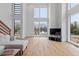 Bright living room with hardwood floors, modern windows, and a comfortable sofa at 512 Gordon St # 1006, Durham, NC 27701
