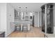 Open floorplan living room featuring a residential elevator, hardwood floors, and natural light at 512 Gordon St # 1006, Durham, NC 27701