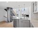 Open floorplan living room featuring a residential elevator, hardwood floors, and lots of natural light at 512 Gordon St # 1006, Durham, NC 27701