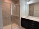 Bathroom features a tiled shower with glass doors, dark wood vanity, and large mirror at 5122 Jessip St, Morrisville, NC 27560