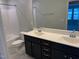 This modern bathroom has dual sinks, a large mirror and neutral paint at 5122 Jessip St, Morrisville, NC 27560