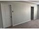 Neutral bedroom with carpet, two doors, and electrical outlets at 5122 Jessip St, Morrisville, NC 27560