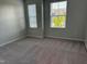 This inviting bedroom has plush carpeting, neutral paint and windows offering natural light at 5122 Jessip St, Morrisville, NC 27560
