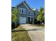 Inviting townhome with a well-maintained lawn, a one-car garage, and a convenient driveway at 5122 Jessip St, Morrisville, NC 27560