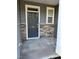 Close-up of the front door with stone trim and clear numbering for easy identification at 5122 Jessip St, Morrisville, NC 27560