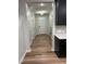 Bright hallway with hardwood floors, a stairway, and access to various rooms in the home at 5122 Jessip St, Morrisville, NC 27560