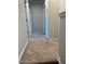 Carpeted upstairs hallway with neutral paint, several doors and entryways, and neutral decor at 5122 Jessip St, Morrisville, NC 27560
