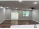Bright and airy living room with hardwood floors, recessed lighting, and a large window at 5122 Jessip St, Morrisville, NC 27560
