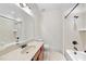 This bathroom has a single vanity, toilet, and shower-tub with neutral tiling at 5217 Roswellcrest Ct, Apex, NC 27539