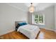 Bedroom with hardwood floors and natural light through the windows at 5217 Roswellcrest Ct, Apex, NC 27539