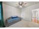 This bedroom offers a comfortable daybed, plush carpet, and neutral walls at 5217 Roswellcrest Ct, Apex, NC 27539