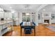 Dining area with hardwood floors, pendant lighting, and a view into the adjacent living room at 5217 Roswellcrest Ct, Apex, NC 27539