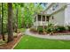 Home exterior featuring a paver pathway, green lawn, and a screened-in porch on the rear of the home at 5217 Roswellcrest Ct, Apex, NC 27539
