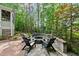 Backyard fire pit area with chairs and a brick patio perfect for outdoor entertaining at 5217 Roswellcrest Ct, Apex, NC 27539