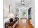 Inviting foyer features hardwood floors, archways, and a console table with decorative accents at 5217 Roswellcrest Ct, Apex, NC 27539