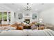 Bright living room featuring a fireplace, built-in shelving, and natural light from large windows at 5217 Roswellcrest Ct, Apex, NC 27539