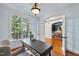 Serene office with custom molding, a view to the exterior, and an archway to another room at 5217 Roswellcrest Ct, Apex, NC 27539