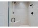 Walk-in shower with tile surround and a built-in bench in this bathroom at 5217 Roswellcrest Ct, Apex, NC 27539