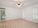 Spacious bedroom featuring a ceiling fan, light hardwood floors, and natural light from the window at 5241 Mill Dam Rd, Wake Forest, NC 27587