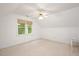 Bright bedroom with a ceiling fan and a window overlooking the outdoors at 5241 Mill Dam Rd, Wake Forest, NC 27587