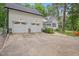 Three-car garage with an extended driveway offering ample parking space at 5241 Mill Dam Rd, Wake Forest, NC 27587