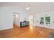 Bright living room featuring hardwood floors, high ceilings, and a large window at 5241 Mill Dam Rd, Wake Forest, NC 27587