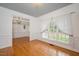 Spacious living room with hardwood floors, trim details, and large windows for natural light at 5241 Mill Dam Rd, Wake Forest, NC 27587