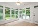 Bright sunroom featuring tile floors, large windows, and ample natural light at 5241 Mill Dam Rd, Wake Forest, NC 27587