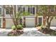 Inviting townhome featuring a one car garage and walkway leading to the front door at 5310 Echo Ridge Rd, Raleigh, NC 27612