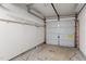 Spacious garage with abundant storage, featuring an overhead rack and organized shelving for optimal organization and convenience at 5310 Echo Ridge Rd, Raleigh, NC 27612