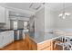 Bright kitchen featuring a stainless steel island, eat-in area, and access to living spaces at 5310 Echo Ridge Rd, Raleigh, NC 27612