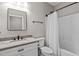 Bathroom featuring a stylish vanity, toilet, and shower with glass door at 59 Mill Rd, Pittsboro, NC 27312