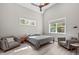 Bedroom featuring high ceilings, two windows, a ceiling fan and two armchairs at 59 Mill Rd, Pittsboro, NC 27312