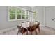 Dining room with a large window offers plenty of natural light and features seating for six at 59 Mill Rd, Pittsboro, NC 27312