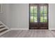 Elegant foyer with hardwood floors and a grand staircase at 59 Mill Rd, Pittsboro, NC 27312
