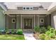 Inviting front porch with stone accents and beautiful landscaping at 59 Mill Rd, Pittsboro, NC 27312