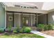 Inviting front porch with stone accents and beautiful landscaping at 59 Mill Rd, Pittsboro, NC 27312