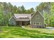 Charming home featuring a well-manicured lawn and inviting front entrance at 59 Mill Rd, Pittsboro, NC 27312