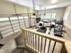 Spacious garage equipped with a home gym, multiple bikes, and a sleek white sports car at 59 Mill Rd, Pittsboro, NC 27312