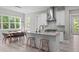 Bright kitchen featuring modern appliances and an island with bar seating at 59 Mill Rd, Pittsboro, NC 27312